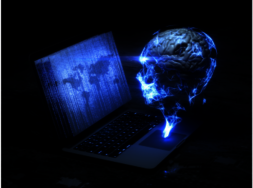 En Laptop, der blau leuchte und daneben ein menschlicher Kopf, ebenfalls blauch leuchtend.