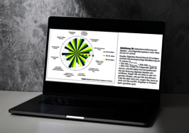 Ein aufgeklappter Laptop, auf dem eine Grafik zu sehen ist.